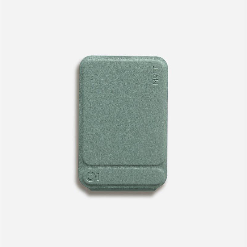 Multifunctional Magnetic Mobile Phone Holder Mobile Phone Case in blue supports a smartphone in camera mode on a desk setup. Ideal for hands-free use and photography.