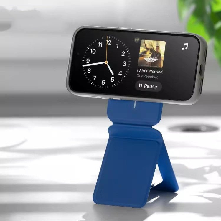 Multifunctional Magnetic Mobile Phone Holder Mobile Phone Case in blue supports a smartphone in camera mode on a desk setup. Ideal for hands-free use and photography.
