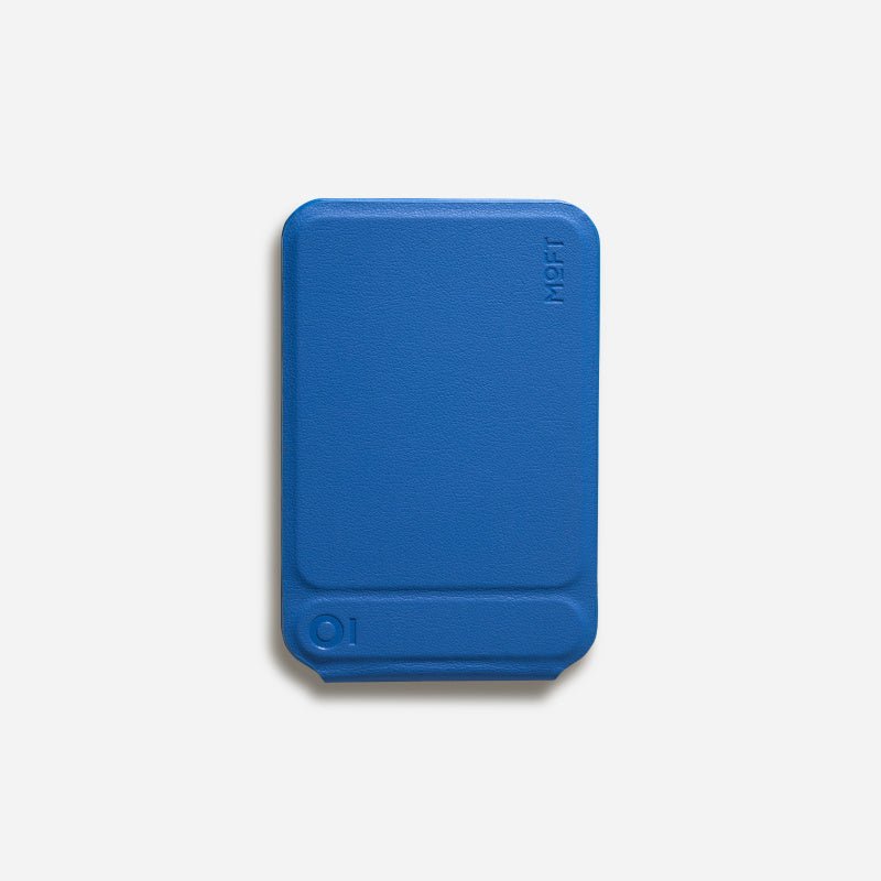 Multifunctional Magnetic Mobile Phone Holder Mobile Phone Case in blue supports a smartphone in camera mode on a desk setup. Ideal for hands-free use and photography.