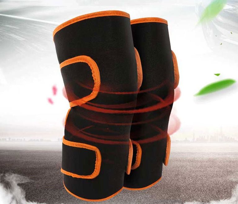Warm heat electric heating knee protector leg vibration massager worn by woman sitting on floor. Multi-function joint massage device for legs.