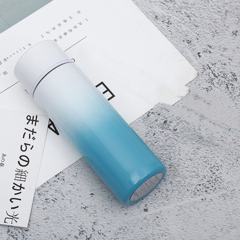 Intelligent stainless steel bottle cup temperature display vacuum flasks in pastel gradient colors, ideal for travel and hot or cold beverages.