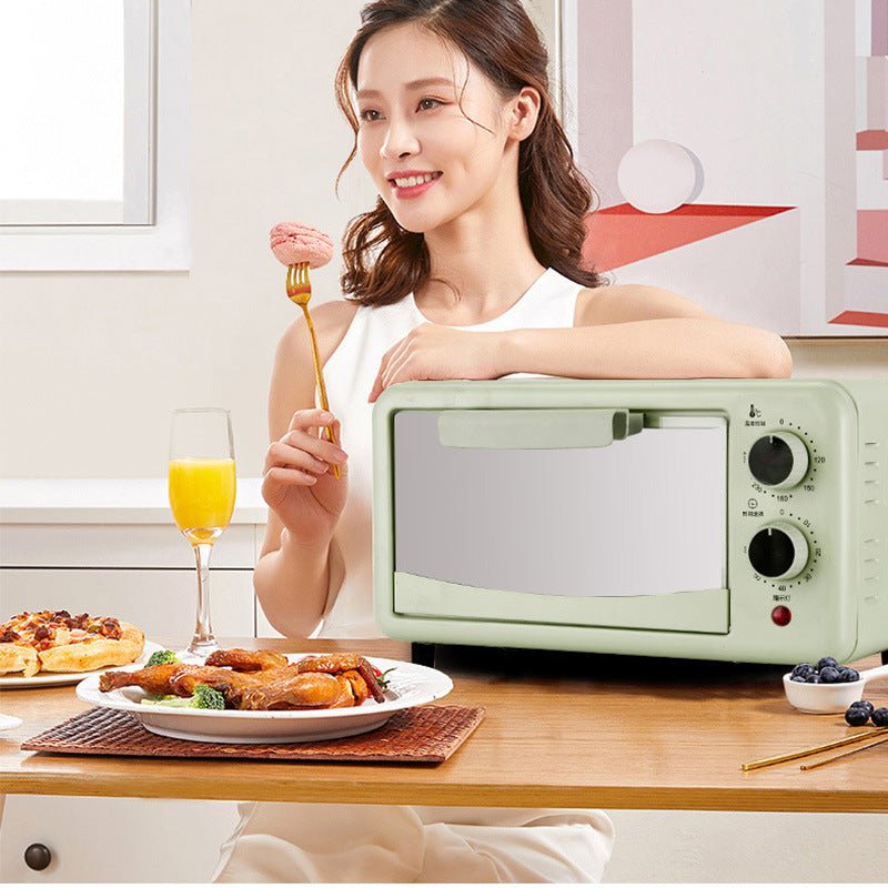 woman using automatic timing steaming and baking all-in-one machine toaster oven on kitchen table with food and juice