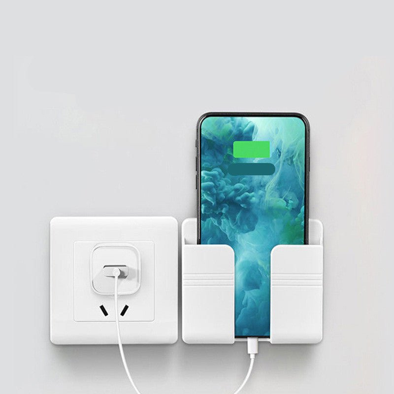 Mobile phone charging storage rack mounted next to power outlet for convenient phone charging.