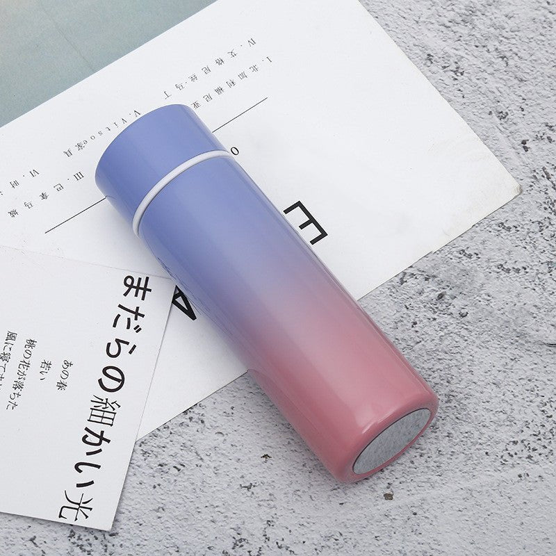 Intelligent stainless steel bottle cup temperature display vacuum flasks in pastel gradient colors, ideal for travel and hot or cold beverages.
