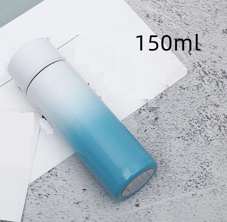 Intelligent stainless steel bottle cup temperature display vacuum flasks in pastel gradient colors, ideal for travel and hot or cold beverages.