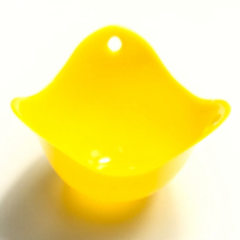 Green Silicone Egg Cooker 4 Color Silicone Egg Cooker set with eggs cooking in colorful silicone cups in a frying pan. Heat-resistant, non-stick kitchen tool.