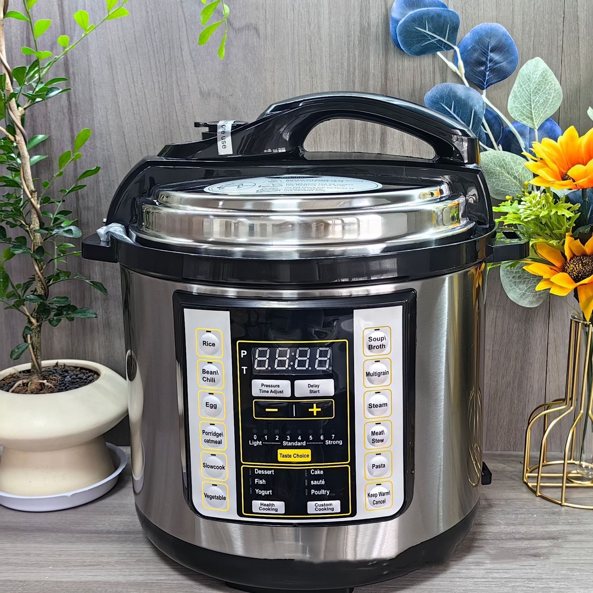6L Electric Pressure Cooker with large capacity, digital LCD display, and multi-functional cooking buttons in stainless steel finish.