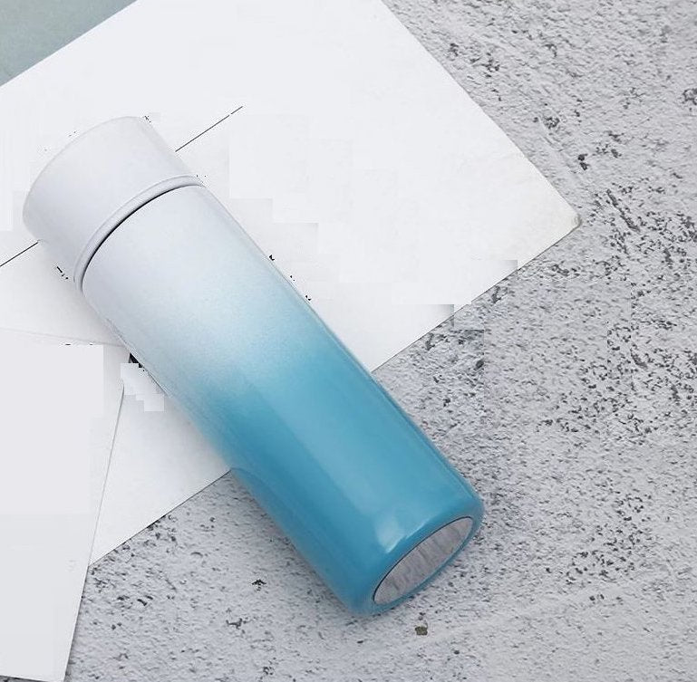 Intelligent stainless steel bottle cup temperature display vacuum flasks in pastel gradient colors, ideal for travel and hot or cold beverages.
