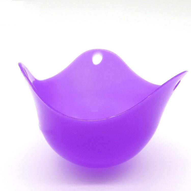 Green Silicone Egg Cooker 4 Color Silicone Egg Cooker set with eggs cooking in colorful silicone cups in a frying pan. Heat-resistant, non-stick kitchen tool.