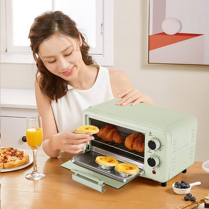 Woman using the Automatic Timing Steaming And Baking All-in-one Machine Toaster Oven to bake croissants and tarts in a modern kitchen setting.