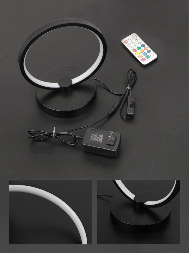 Atmosphere Desk Lamp Bedroom RGB Gaming Colorful Creative with circular LED design, placed beside a gaming monitor and RGB keyboard. Ideal for ambient lighting.