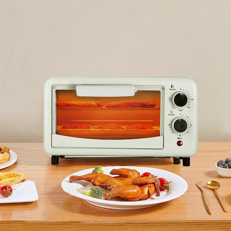 Apple green Automatic Timing Steaming And Baking All-in-one Machine Toaster Oven with visible heating and roasted food inside on a dining table.