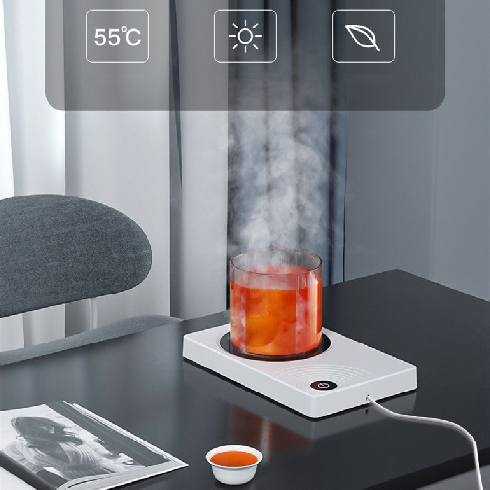 Smart home office heating coaster with white square design keeping a glass of hot tea warm on a black desk