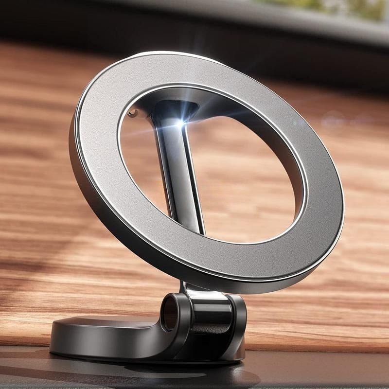 Magnetic car phone mount with all-metal foldable design shown attached to car air vent, holding a smartphone with GPS navigation screen.