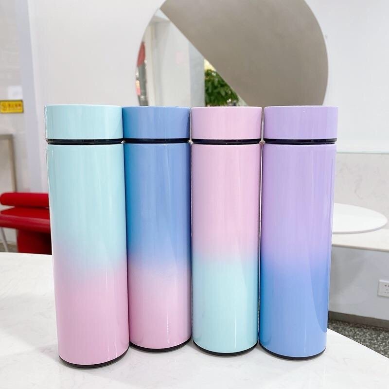 Set of four intelligent stainless steel bottle cups with temperature display, vacuum insulated, in pastel gradient colors for travel and daily use