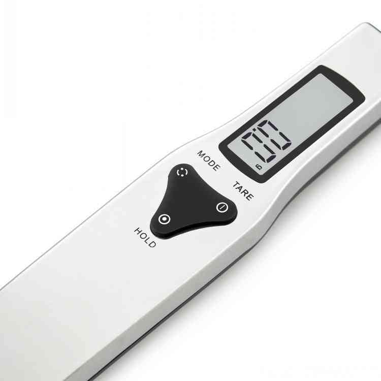 Digital Measuring Spoon with LCD display showing weight, features mode, tare, and hold buttons for precise measurements up to 500g.