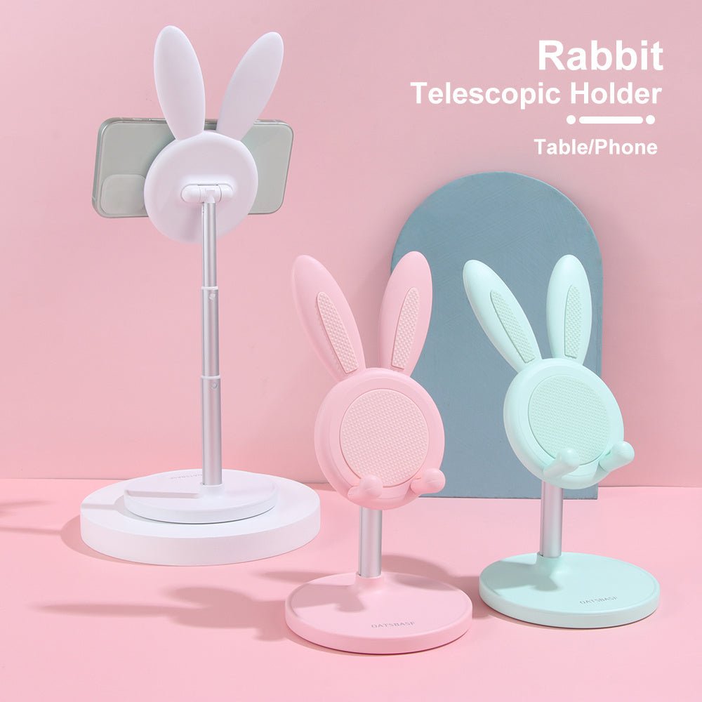 Adjustable telescopic mobile phone desktop stand with rabbit ears in white, pink, and green colors for general phone and tablet use.