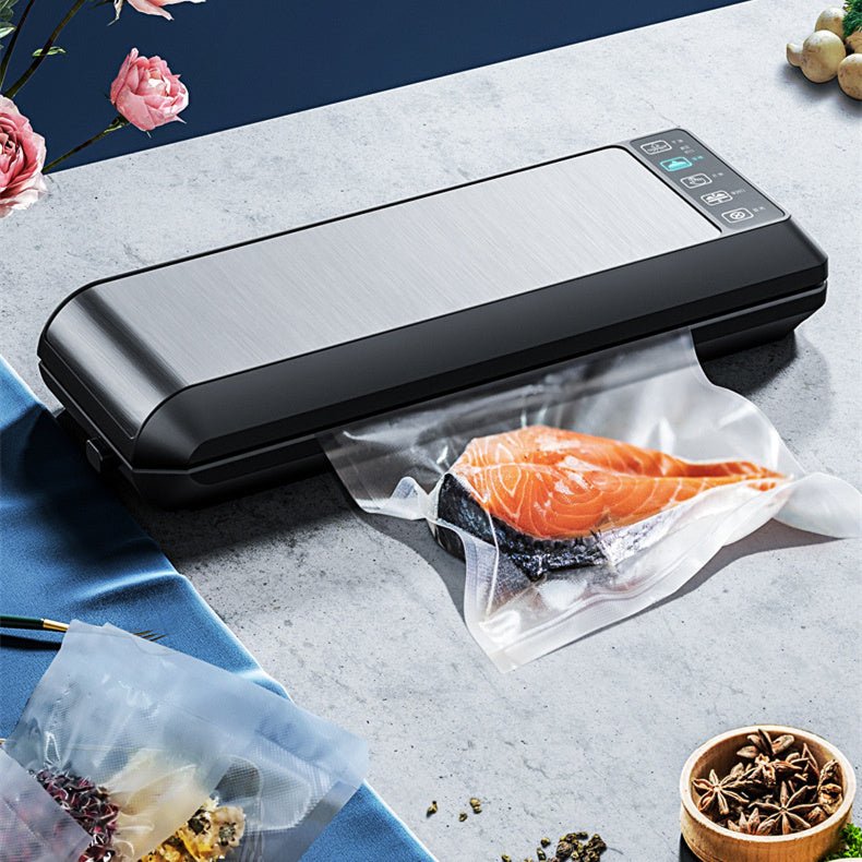 Home Vacuum Sealer Food Sealer sealing fresh salmon in vacuum bag on kitchen counter. Compact HP-9007 model with digital controls for food preservation.