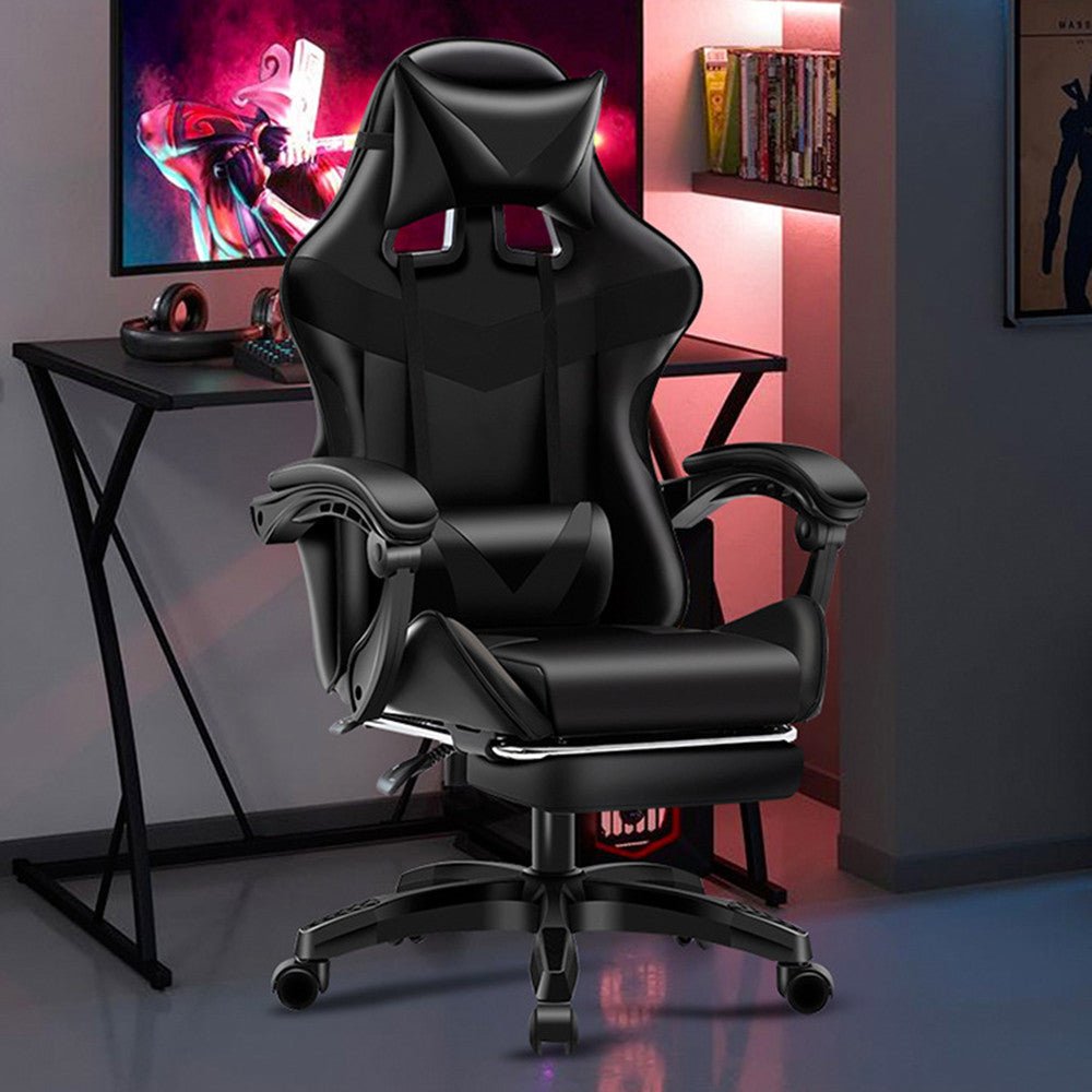 Black leather gaming chair with reclining feature and footrest in a home office setup