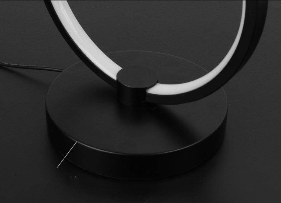 Atmosphere Desk Lamp Bedroom RGB Gaming Colorful Creative with circular LED design, placed beside a gaming monitor and RGB keyboard. Ideal for ambient lighting.