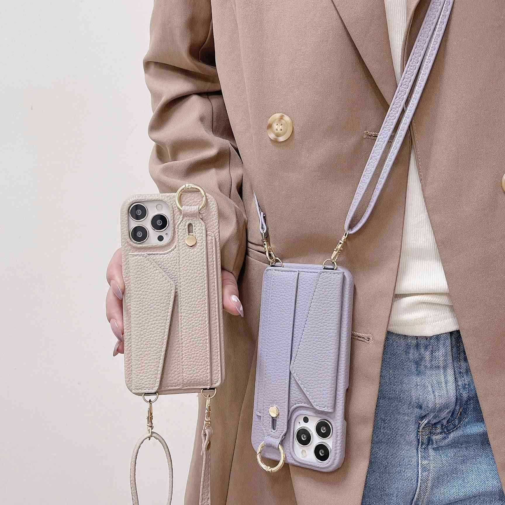 Leather back strap phone cases in beige and light purple with detachable straps, shown worn and held for easy carrying and protection.
