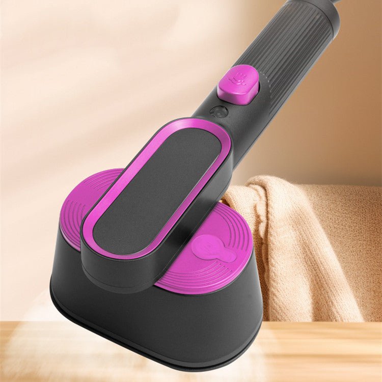 Household Small Portable Steamer  in black and pink used to steam a beige blazer sleeve. Compact vacuum steamer ideal for home use.